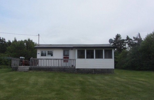 Morell Cottage | Two Bedroom Cottage With Open Concept Leading To Large Patio And Screened Porch.