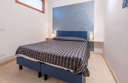 Assenza Apartment | Two-room apartment Due Leoni with lake view, swimming pool, garden and Wi-Fi