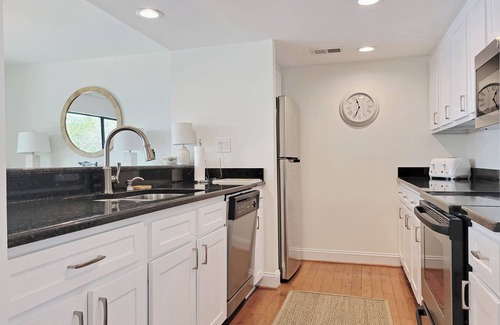 Litchfield by the Sea Condo | Two-Story Beach Townhouse, Lake View, Easy Walk to Beach, Pool, Covered Parking