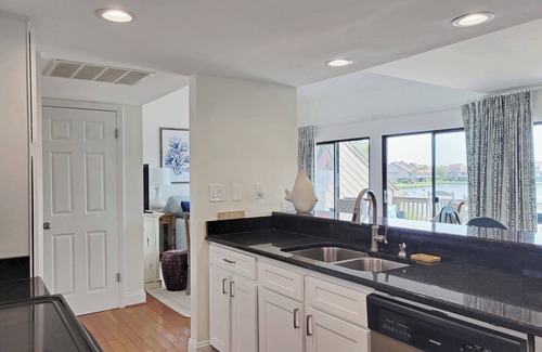 Litchfield by the Sea Condo | Two-Story Beach Townhouse, Lake View, Easy Walk to Beach, Pool, Covered Parking