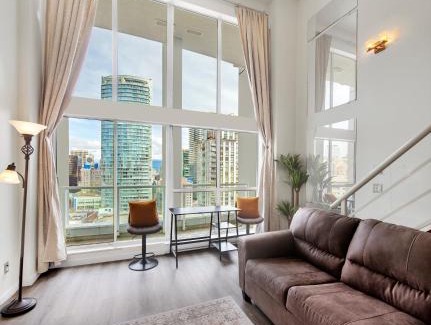 Downtown Vancouver Apartment | Two-Story Loft with a High-rises view and Rooftop Deck