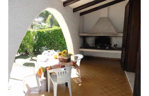 Bibione House | Two-story townhouse with private garden