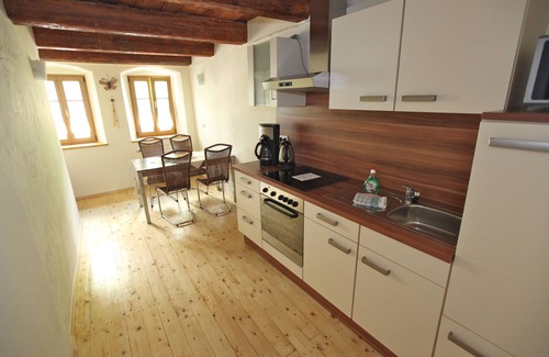 Altstadt Apartment | under a historical exposed wooden beam ceiling, monument protection