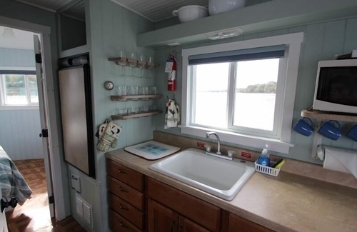 Mac Mahan Boat Rental | Unique, romantic, motorless floating island w/4 hp skiff
