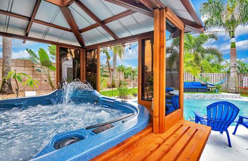 Tropic House | Urban Oasis withHot Tub, HEATED POOL and Private Movie Theater home