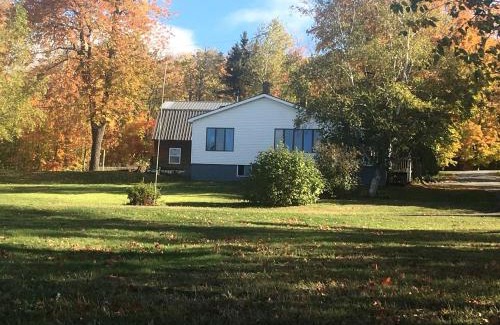 Portage Lake House | Embrace Nature in this Breathtaking Cottage in Portage Lake, Maine