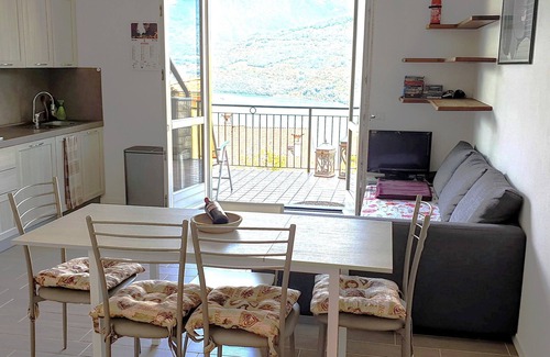 Tavernola Bergamasca Apartment | Vacation apartment with wonderful panoramic lake view, 2 terraces, pool, parking lot