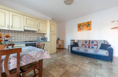 Sant'Antioco House | Vacation Home "Casa Vacanza L'Agave A" with Shared Terrace, A/C & Wi-Fi