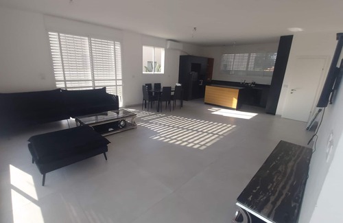 Netanya Cottage | Very beautiful penthouse with a hot swimming pool under blue skies .
