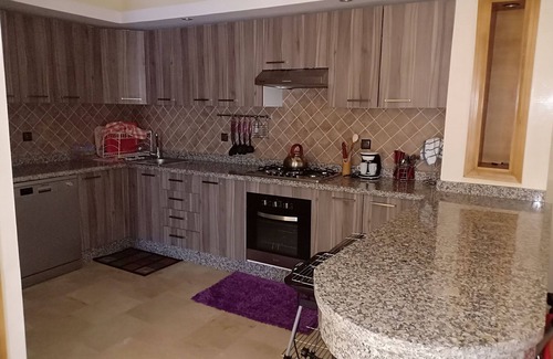 Lamharza Essahel Villa | Villa front pool and garden at Savannah beach