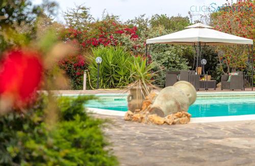 Porto Torres Villa | Villa Melograno with exclusive swimming pool surrounded by greenery