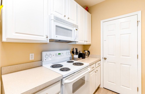 Rehoboth Beach Condo | Villas At Bay Crossing homey condo with pool, beach gear, WiFi, and private W/D