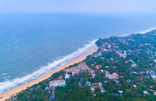 Varkala Hotel | VOYE HOMES Signature Pool Resort Varkala , Just 950 m from Varkala Cliff and Beach