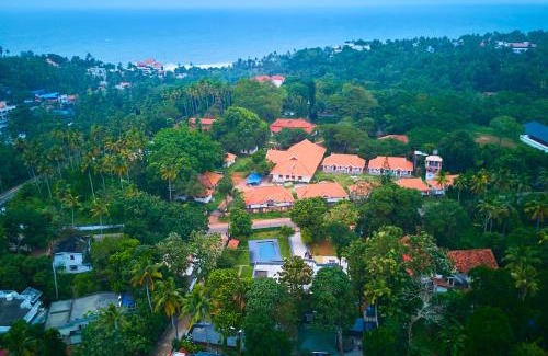 Varkala Hotel | VOYE HOMES Signature Pool Resort Varkala , Just 950 m from Varkala Cliff and Beach