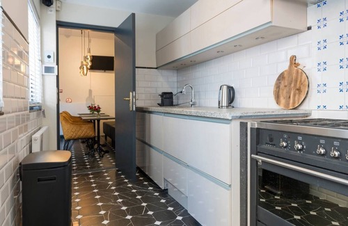 Centrum Apartment | Wake up in the heart of Tilburg in a cozy hotel bed that blends past charm with modern comfort