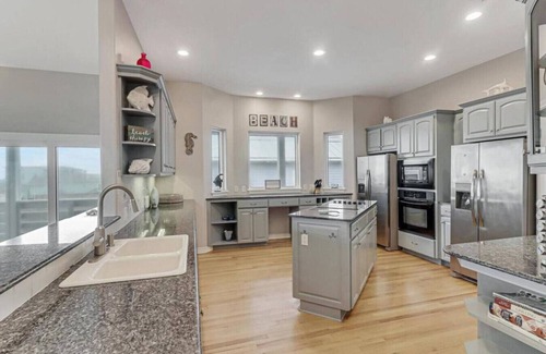 Sand Point House | Wake Up to Ocean Breezes: Elevator Access, Beach Views, and a Boardwalk to Paradise.