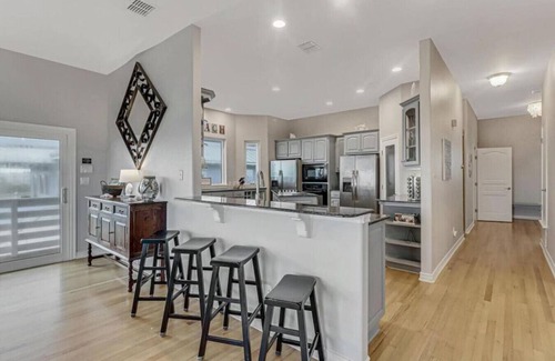 Sand Point House | Wake Up to Ocean Breezes: Elevator Access, Beach Views, and a Boardwalk to Paradise.