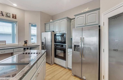 Sand Point House | Wake Up to Ocean Breezes: Elevator Access, Beach Views, and a Boardwalk to Paradise.