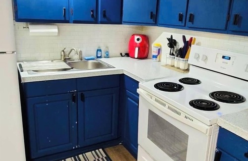 Troy House | Warm and cozy basement.