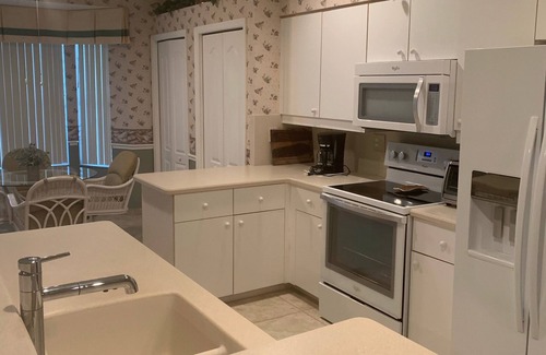 Estero Villa | Water and golf course views in Country Creek!