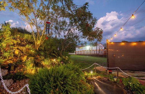 Sugarmill Woods Cabin | Waterfall Suite at Zen at the Palms with a Private Hot Tub by the Waterfall!