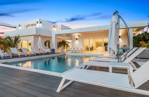 Leeward Settlement House | Waterfront Luxury Villa with Optional Boat and Beach Access Just Steps Away