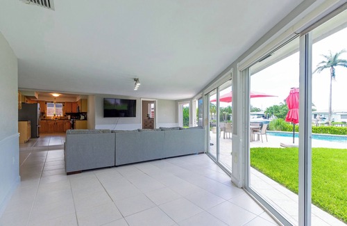 Garden Isles House | Waterfront home with private backyard. Heated pool with waterfall Jacuzzi