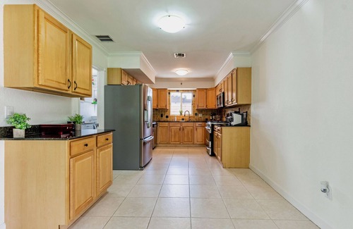 Garden Isles House | Waterfront home with private backyard. Heated pool with waterfall Jacuzzi