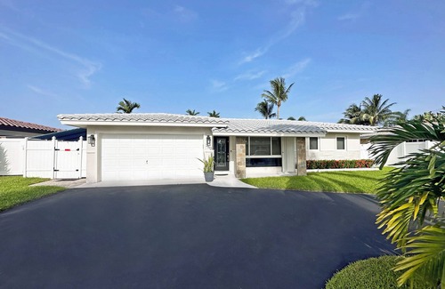 Garden Isles House | Waterfront home with private backyard. Heated pool with waterfall Jacuzzi