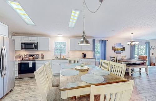Bumpass House | Waterfront home with boat dock, outdoor bar/TV, firepit, and yard games