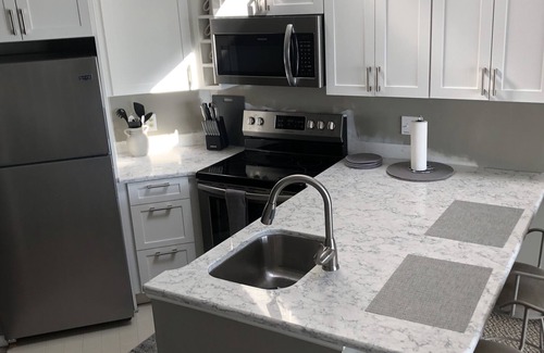 Charlevoix Condo | Waterfront Setting w/Top-Floor Views Overlooking Lake Charlevoix