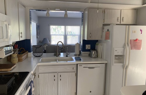 Venice Groves House | Waterfront single home rental with private lanai, heated pool, and hot tub!