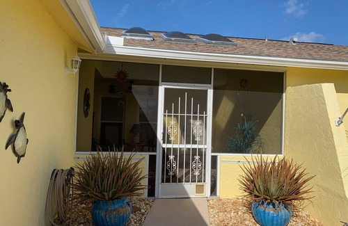 Venice Groves House | Waterfront single home rental with private lanai, heated pool, and hot tub!
