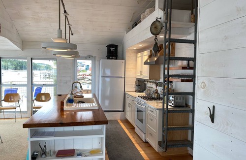 Georgetown Cottage | Waterfront, west facing, modernized fisherman’s cottage perched on the water.