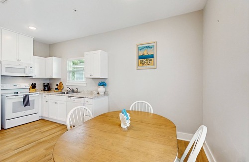 Fulton House | Welcoming coastal home with shared pool, stocked fishing pond - kitchen & patio