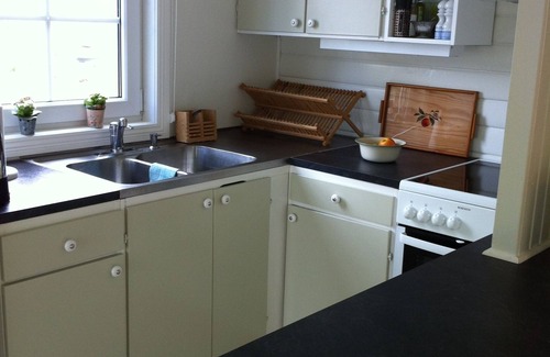 Hestra House | Winter garden and living room with view on the lake, 2 bedrooms.