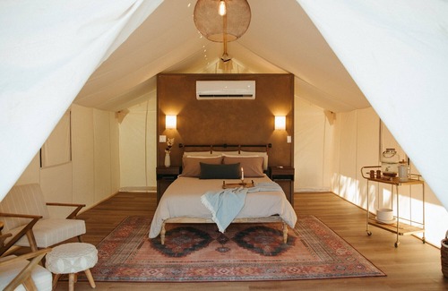 Prairie Lea RV Rental | Wooded retreat space with glamping tents, container homes & tons of amenities!
