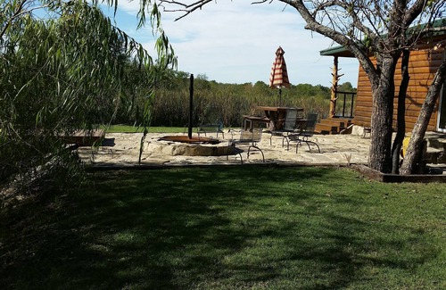 Fittstown Cabin | Your own private lakefront log cabin on a 1155 acre ranch.