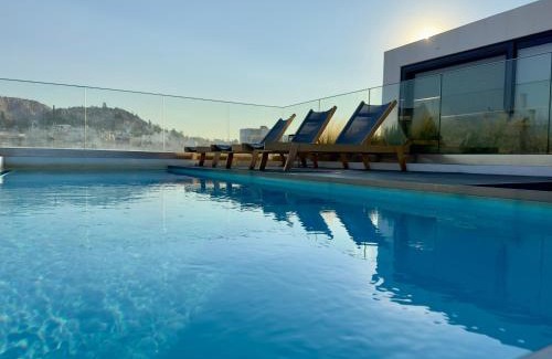 Athens Apartment | Zefyros Home - Luxe Stay with Shared Pool & Gym by TT