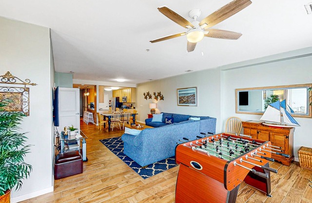 1st-floor condo near the beach with balcony, grills, outdoor pool & gym