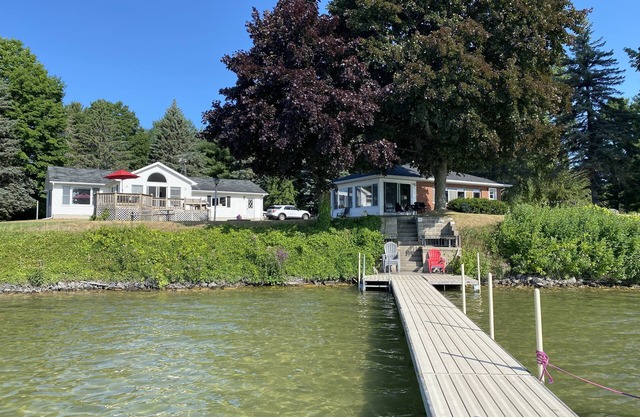 200 feet of pristine lake frontage & two cottages - One rental fee