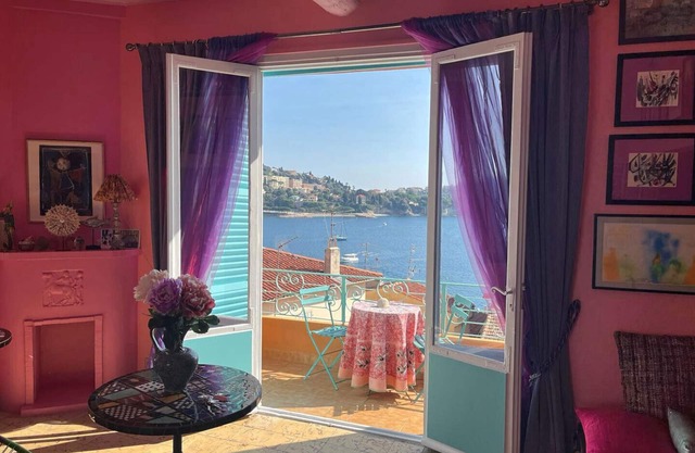 26. A colorful apartment with a beautiful sea view and a balcony