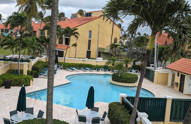 2BR/2BA Villa beach front, golf w/WiFi, large balcony, steps from the sand!