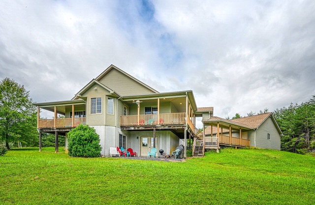 +4 acre lakefront retreat with private boat slip, wraparound porch, grill, & W/D