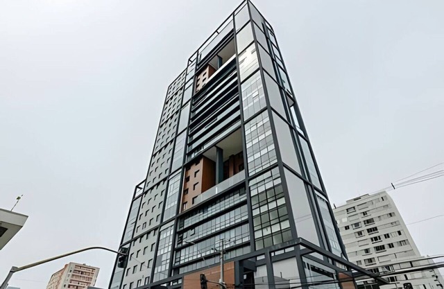 A bedroom and living room, in the trendy Elysia building.