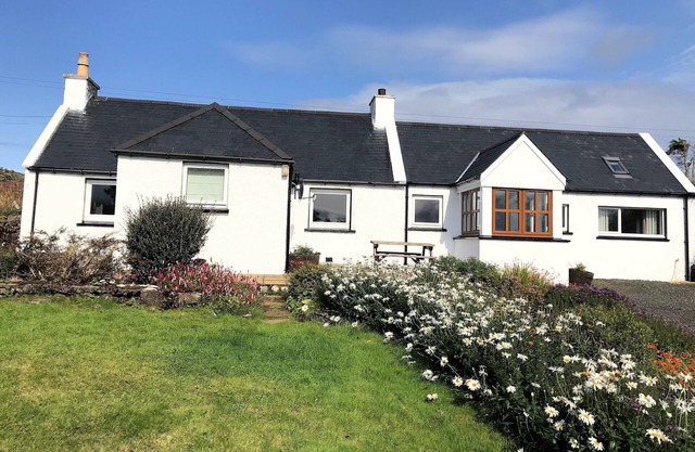 A cosy three bedroomed cottage on the Isle of Skye with stunning sea views.