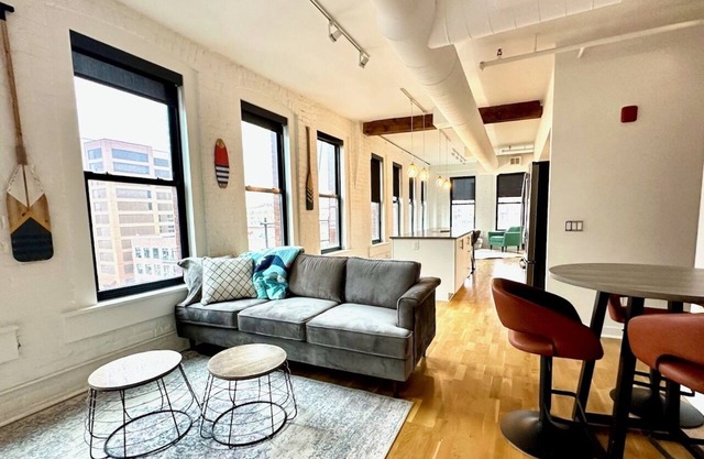 A historic beautifully detailed suite, 1,300 square foot, corner loft in the heart of the Old Market