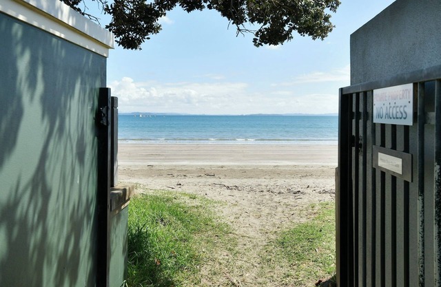 A Kiwi beachside holiday a couple of minutes walk to the sand .