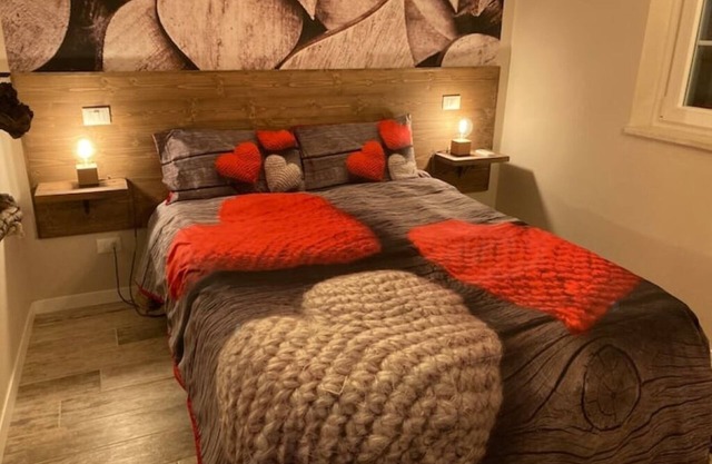 A short distance from Lake Garda surrounded by greenery stands RedHouse