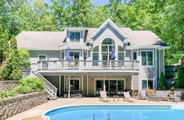 Airy home with private pool, hot tub, big game room, & golf cart - walk to beach